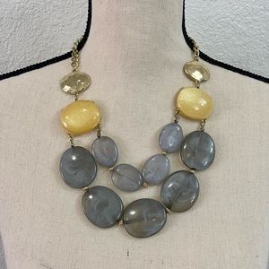 Fashion necklace with chunky gold tone & grey blue stones